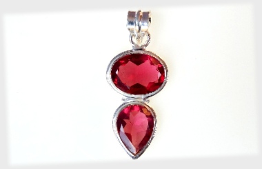 Pink Topaz Swinging Pear Pendant in Bezel Set Silver.